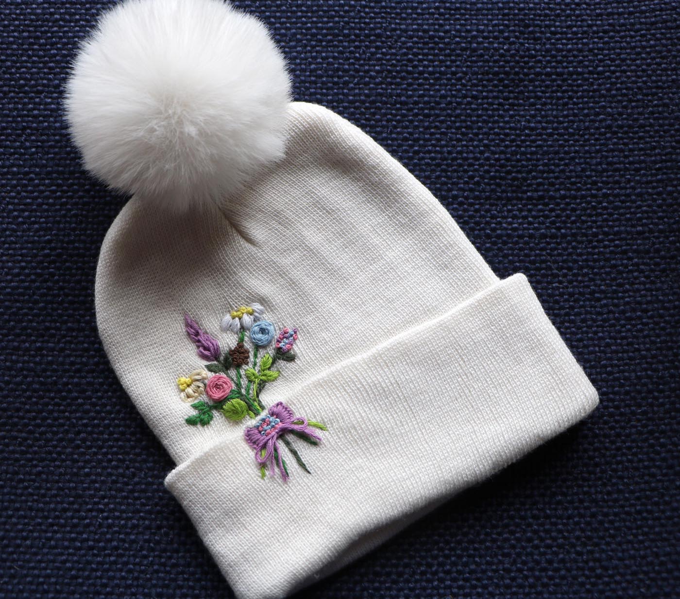 Hand-Embroidered White Beanie with Pom Pom — Flower Bouquet — photo 1