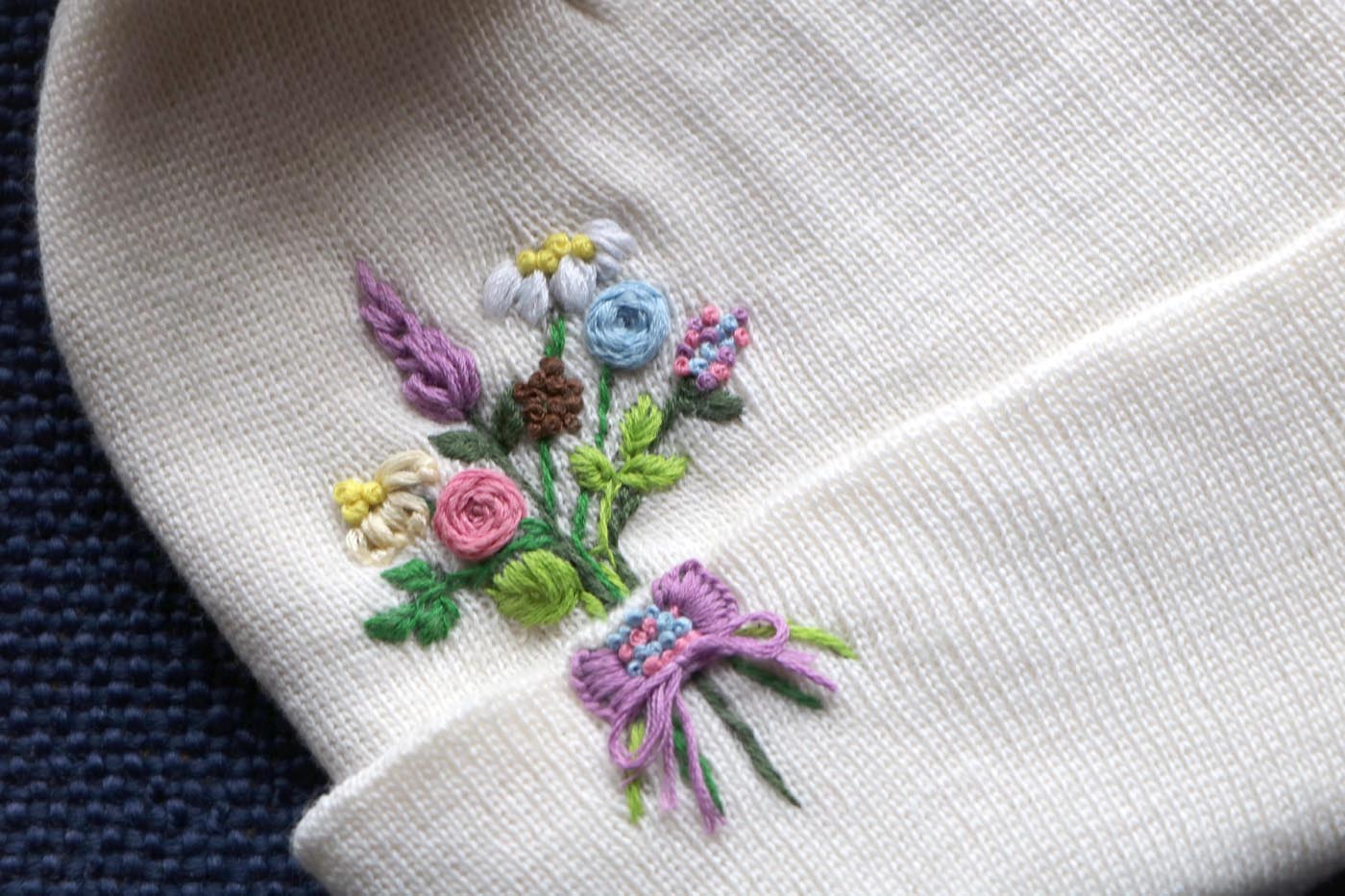 Hand-Embroidered White Beanie with Pom Pom — Flower Bouquet — photo 2