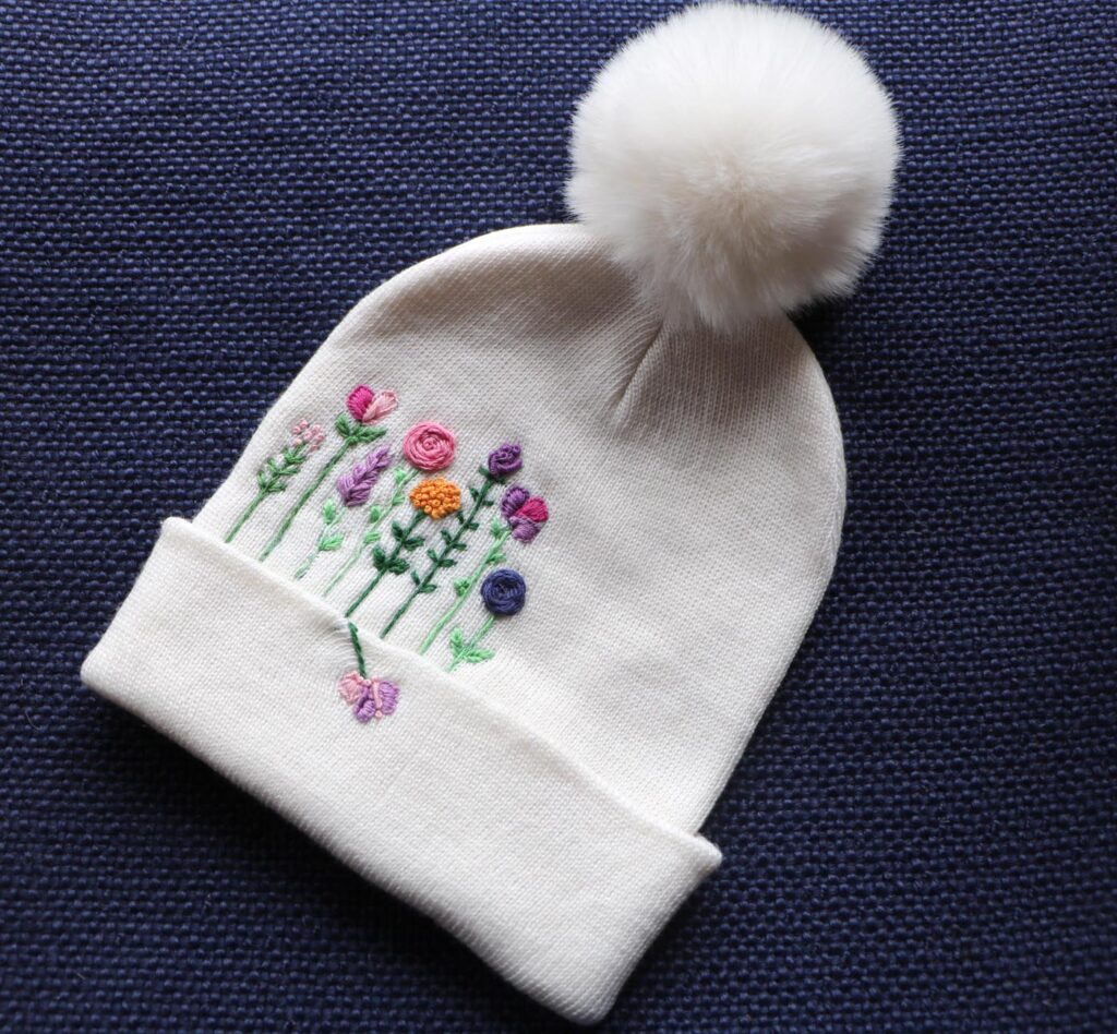 Hand-Embroidered White Beanie with Pom Pom — Flower Forest — photo 1