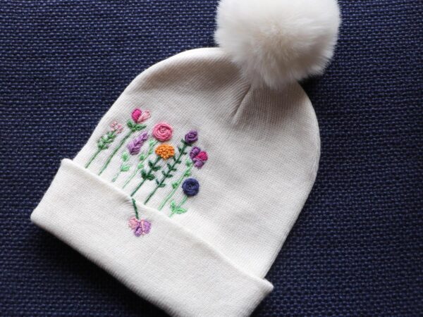 Hand-Embroidered White Beanie with Pom Pom — Flower Forest — photo 1