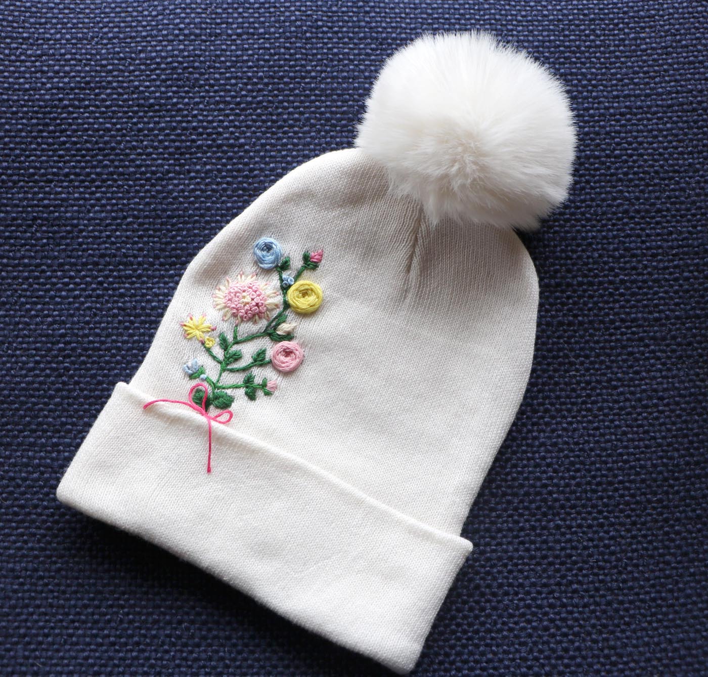 Hand-Embroidered White Beanie with Pom Pom — Pink Yellow Blue Flowers — photo 1